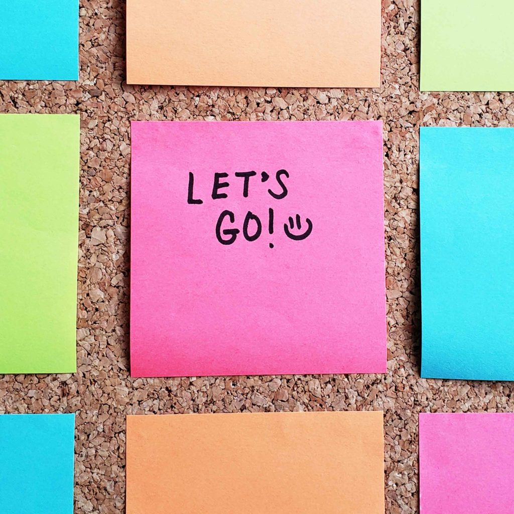 Content Marketing: Sticky note with "Let's GO! :) "