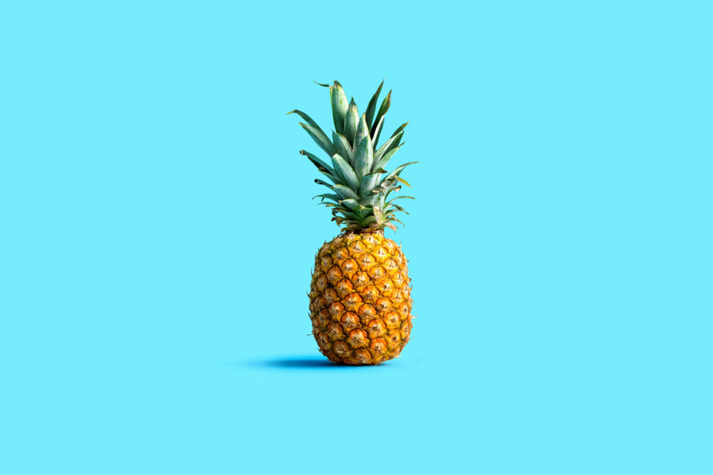 Pineapple on a sky blue background.